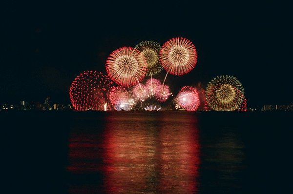 fireworks at night overlooking water